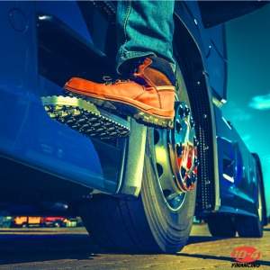 foot on step of semi truck cab, climbing in truck