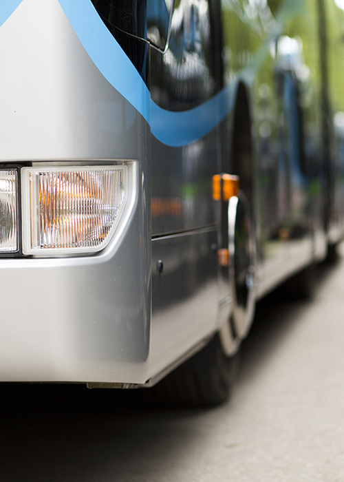 close up of front quarter panel of touring bus